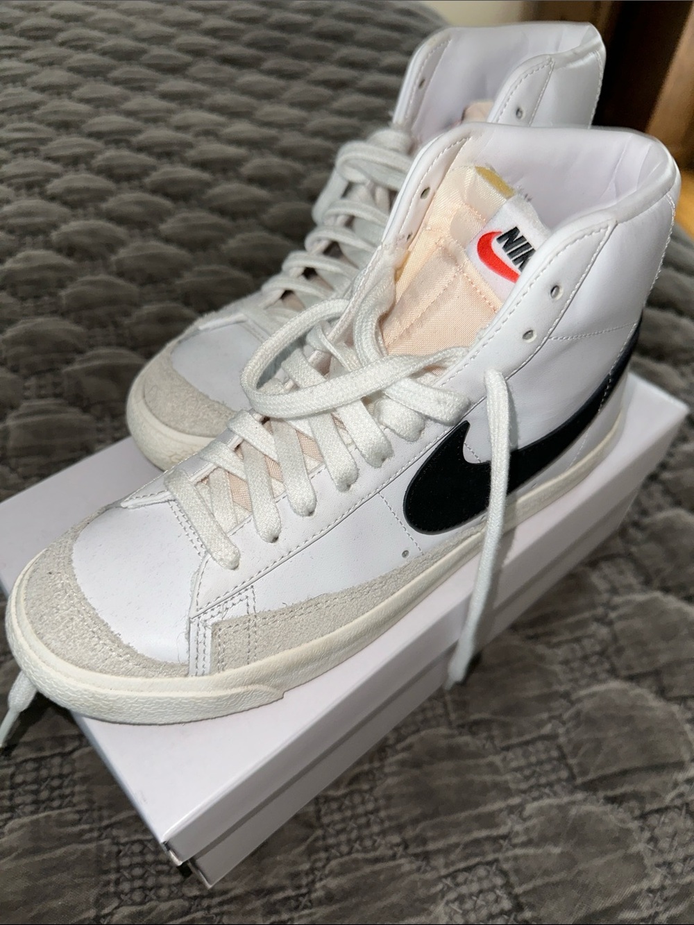 Nike White High-Top Sneakers with Black Swoosh and Gray Suede Toe